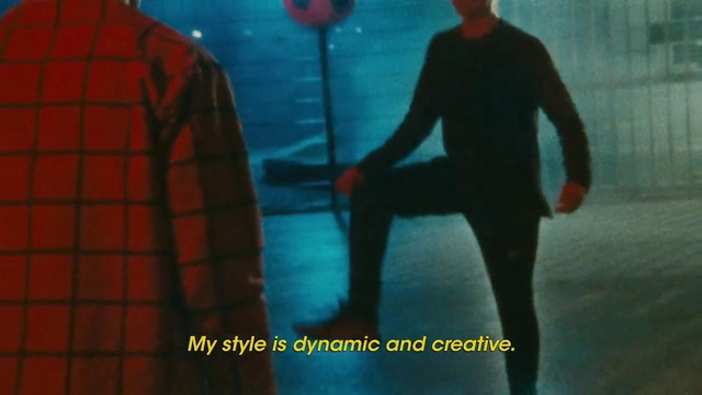 Video Reference: Blue, Design, Textile, Pattern, Organism, Electric blue, Photography, Fictional character, Tartan, Person, Man, Outdoor, Walking, Carrying, Holding, Standing, Surfing, Water, Shirt, Wearing, Board, Red, Woman, Young, Suit, Court, White, Game, Ocean, Dog, Riding, Street, Text, Clothing