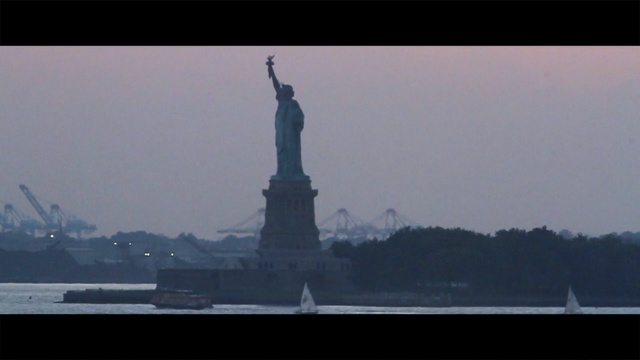 Video Reference: statue, landmark, monument, sky, national historic landmark, sea, skyline, memorial, haze, water