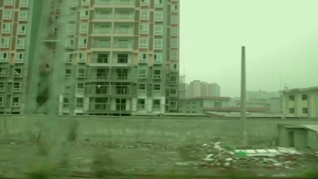 Video Reference: Metropolitan area, Metropolis, Tower block, Skyscraper, Condominium, Building, Urban area, Green, Neighbourhood, City, Person