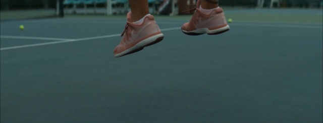 Video Reference: footwear, sport venue, tennis court, tennis, shoe, racquet sport, structure, racket, tennis player, competition event