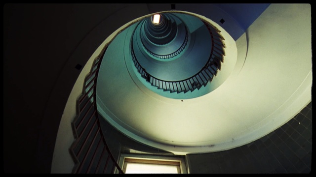 Video Reference: Architecture, Stairs, Eye, Photography, Circle, Spiral, Daylighting, Symmetry, Indoor, Table, Sitting, Small, Cake, Light, White, Plate, Glass, Large, Standing, Plane, Kitchen