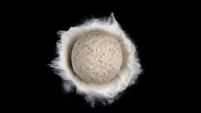 Video Reference: Product, Powder, Wheat flour, Food, Indoor, Looking, Dark, Sitting, White, Black, Cake, Green, Laying, Table, Yellow