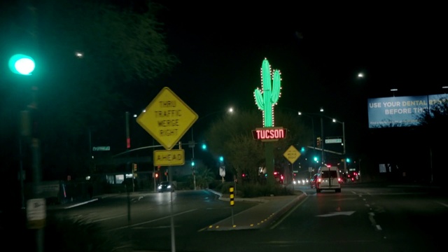 Video Reference: Night, Metropolitan area, Green, Lighting, Light, Street light, Road, Lane, Signage, Midnight