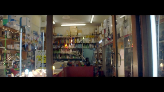 Video Reference: display window, liquor store, retail, glass, window, Person