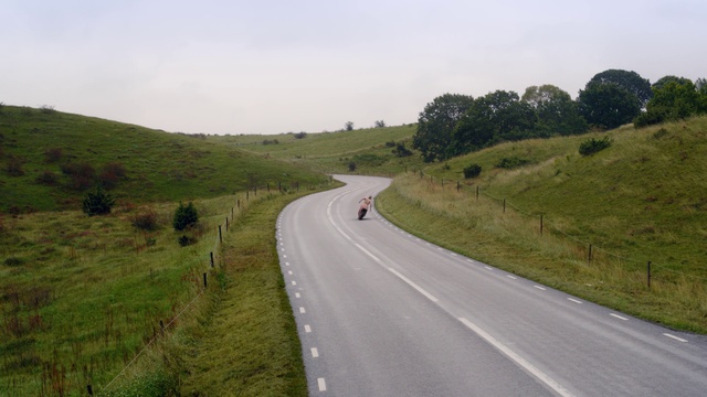 Video Reference: Road, Thoroughfare, Lane, Highland, Infrastructure, Asphalt, Grassland, Highway, Hill, Pasture