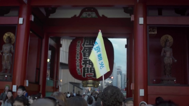 Video Reference: Place of worship, Shrine, Temple, Temple, Banner, Crowd, Building, Advertising, Signage, Flag, Person