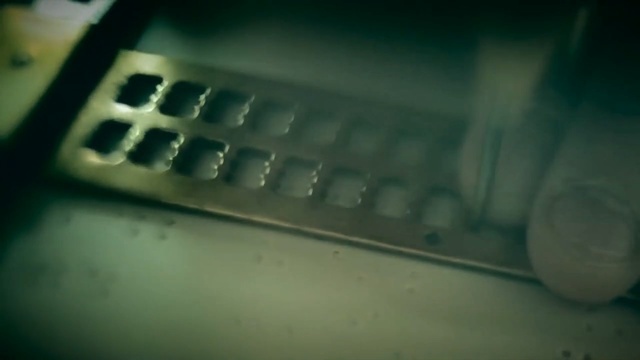 Video Reference: Green, Close-up, Office equipment, Technology, Electronic device, Automotive exterior, Photography, Electronics, Automotive window part, Person