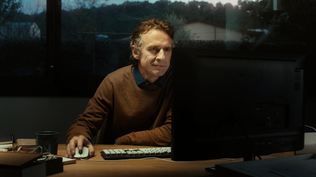 Video Reference: electronic device, sitting, darkness, technology, night, fun, audio engineer, music, Person