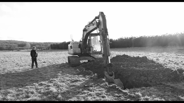 Video Reference: black and white, tree, vehicle, monochrome photography, water, monochrome, automotive tire, tire, landscape, grass, Person