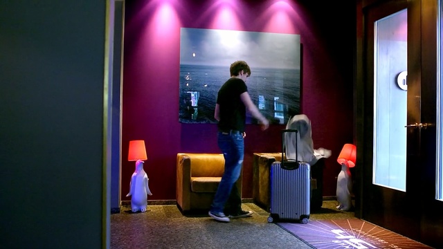 Video Reference: room, electronic device, lighting, technology, television program, display device, interior design, Person