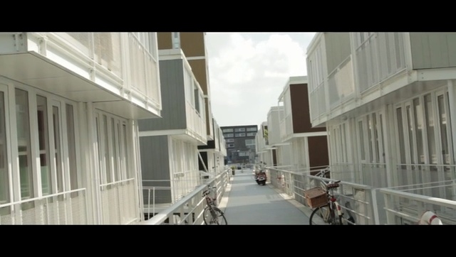 Video Reference: Architecture, Neighbourhood, Metropolitan area, Town, Building, Snapshot, Human settlement, Facade, Mixed-use, Urban area