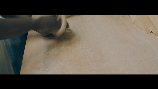 Video Reference: skin, nose, floor, flooring, hand, wood, arm, mouth, finger, line, Person