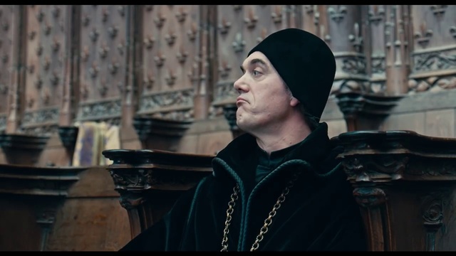 Video Reference: Headgear, Screenshot, Person, Man, Indoor, Wearing, Kitchen, Holding, Table, Front, Standing, Hat, Shirt, Sitting, Young, Black, Computer, Woman, Large, Phone, White, Human face, Clothing, Text