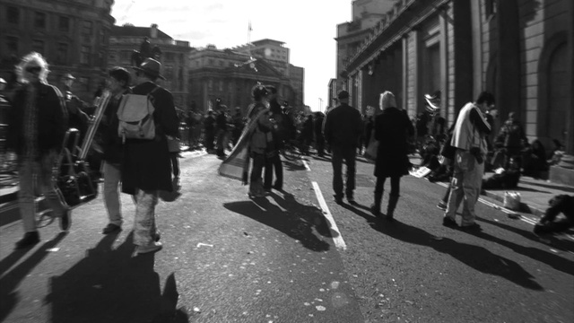 Video Reference: black, photograph, street, black and white, road, pedestrian, crowd, infrastructure, urban area, monochrome photography, Person