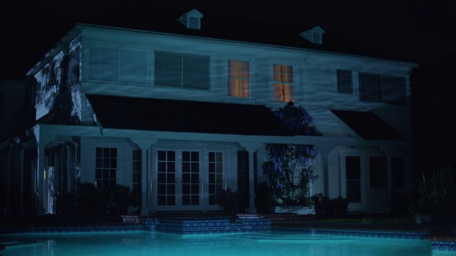 Video Reference: House, Home, Property, Blue, Light, Night, Lighting, Building, Architecture, Real estate, Outdoor, Water, Sitting, Street, Large, Boat, White, Man, Red, Standing, Parked, City, Stop, Pool, Sign, Riding, Docked, Traffic, Window, Swimming pool