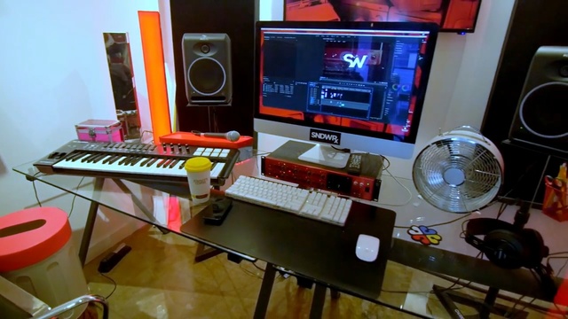 Video Reference: studio, electronic instrument, musical instrument, musical instrument accessory, recording, electronics, sound, furniture, desk, electronic device, Person