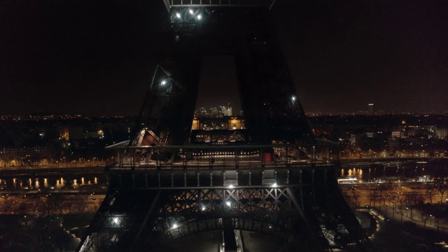 Video Reference: Night, Landmark, Architecture, Metropolitan area, City, Tower, Metropolis, Sky, Cityscape, Midnight, Building, Train, Bridge, Track, Large, Light, Lit, Sitting, Snow, View, Table, Water, Traveling, Platform, Station, White, Display, Standing, Plane, Riding, Clock, River, Skyscraper, Moon, Arch