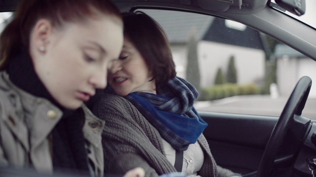Video Reference: Face, Child, Driving, Nose, Cheek, Interaction, Cool, Human, Vehicle door, Vehicle, Person
