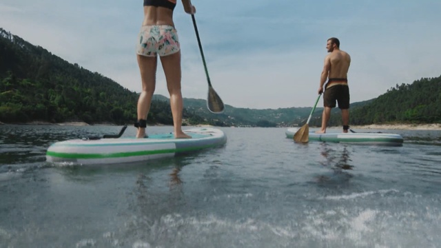 Video Reference: water transportation, surface water sports, surfing equipment and supplies, boardsport, leisure, boats and boating equipment and supplies, wakesurfing, paddle, vacation, surfboard, Person