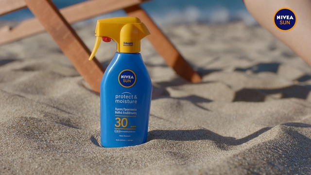 Video Reference: Product, Sunscreen, Spray, Bottle, Indoor, Sitting, Table, Computer, Laptop, Toy, Black, Open, Small, Close, Little, Toothbrush, Front, Apple, Banana, Laying, Keyboard, Plastic, Desk, Red, Water, Mouse, Holding, Cat, Bed, White, Blue, Stuffed, Drink