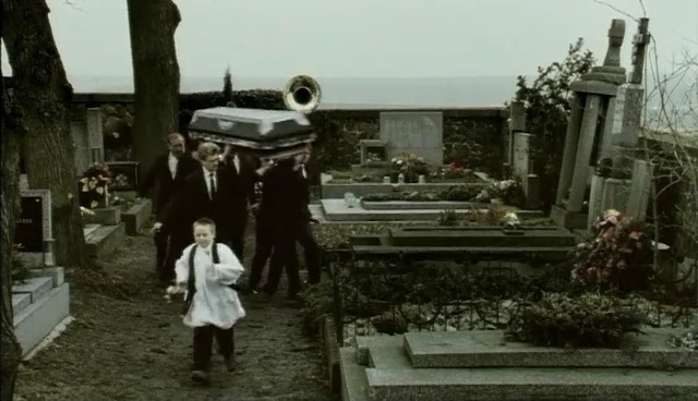 Video Reference: cemetery, vehicle, grave, car, monument, Person