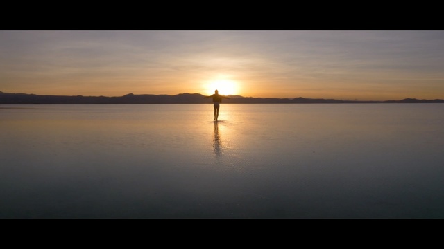 Video Reference: Sky, Horizon, Water, Sunrise, Sunset, Calm, Reflection, Evening, Sun, Morning, Person