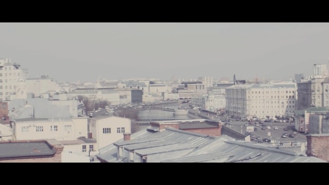 Video Reference: Urban area, Atmospheric phenomenon, Sky, City, Metropolitan area, Roof, Daytime, Cityscape, Horizon, Human settlement, Person