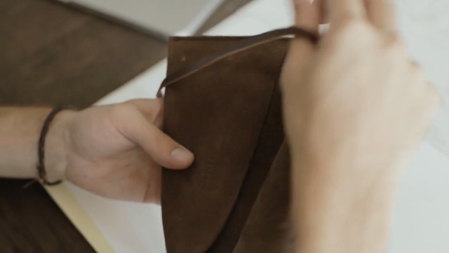 Video Reference: Leather, Brown, Bag, Fashion accessory, Glasses, Wallet, Person