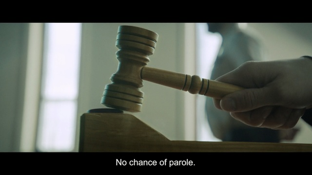 Video Reference: Hand, Finger, Metal, Indoor, Person, Man, Table, Front, Screen, Holding, Kitchen, Mirror, Food, Monitor, Counter, Keyboard, Woman, Computer, Standing, White, Clock, Pizza, Screenshot, Text, Weapon