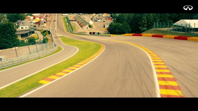 Video Reference: Race track, Asphalt, Road, Yellow, Thoroughfare, Sport venue, Infrastructure, Lane, Vehicle, Road surface