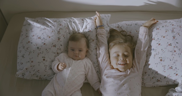 Video Reference: Child, People, Product, Room, Baby, Textile, Bed, Toddler, Linens, Bedding, Person