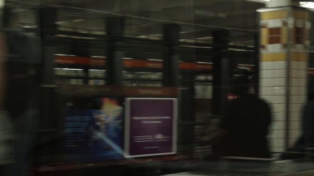 Video Reference: urban area, glass, public transport, electronic device, darkness, technology, city, window, inventory, display device, Person