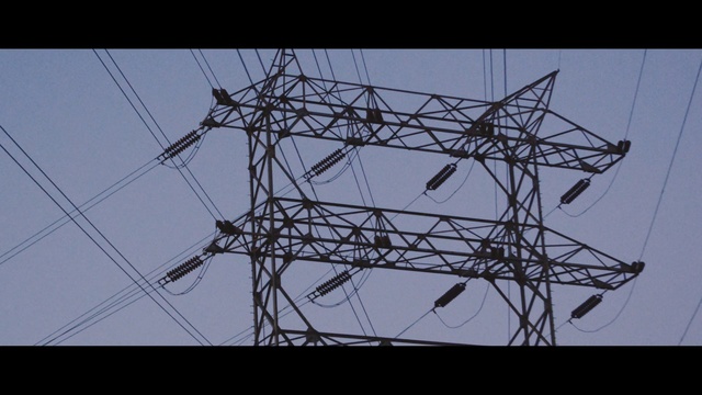 Video Reference: overhead power line, electricity, electrical supply, transmission tower, sky, structure, public utility, line, energy, tower, Person