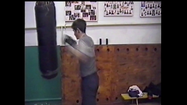 Video Reference: Photograph, Punching bag, Standing, Arm, Snapshot, Wall, Room, Shoulder, Leg, Font