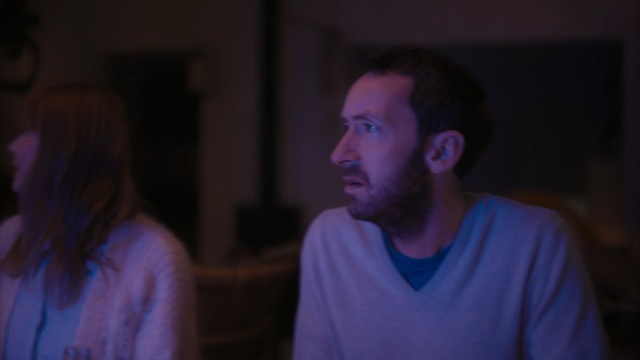 Video Reference: Face, Blue, Fun, Cheek, Chin, Purple, Forehead, Human, Night, Mouth, Person, Man, Indoor, Looking, Standing, Holding, Front, Young, Shirt, Sitting, People, Woman, Glasses, Couple, Video, Food, Table, Using, Laptop, Room, Wine, Computer, Playing, Remote, Game, Group, White, Wii, Human face, Clothing