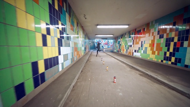 Video Reference: infrastructure, wall, subway, metropolitan area, road, art, leisure centre, mural, daylighting, Person
