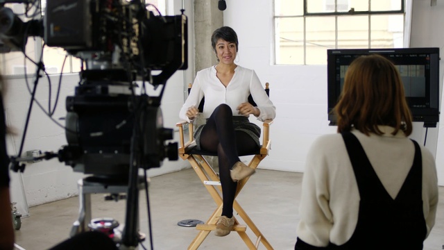 Video Reference: Shoulder, Photography, Style, Person, Table, Woman, Man, Chair, Standing, Holding, Food, Front, People, Desk, Computer, Suit, Kitchen, Dog, Young, Eating, White, Plate, Clothing