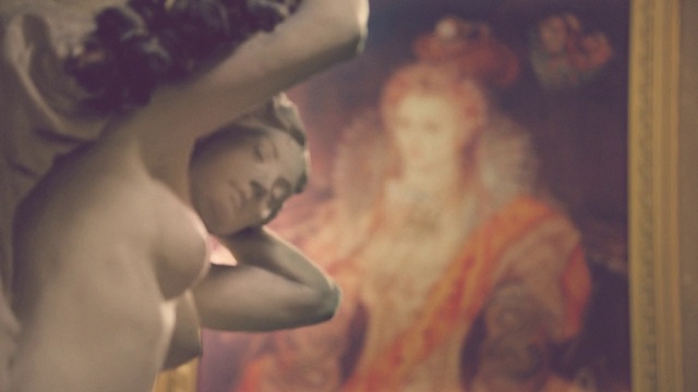 Video Reference: Art, Painting, Human, Visual arts, Muscle, Photography, Neck, Chest, Flesh, Child, Person, Indoor, Holding, Man, Cake, Food, Sitting, Woman, Plate, Mirror, Pizza, Room, White, Standing, Hat, Statue, Human face, Sculpture