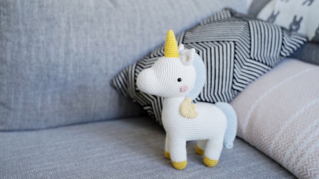 Video Reference: yellow, stuffed toy, toy, textile, plush, material, cat, product