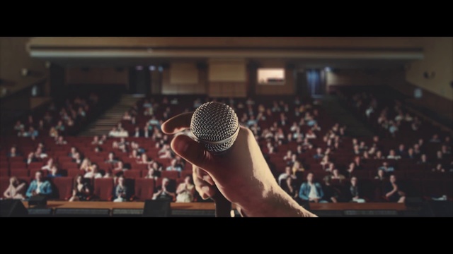 Video Reference: Microphone, Audience, Audio equipment, People, Public speaking, Music artist, Crowd, Talent show, Song, Singing