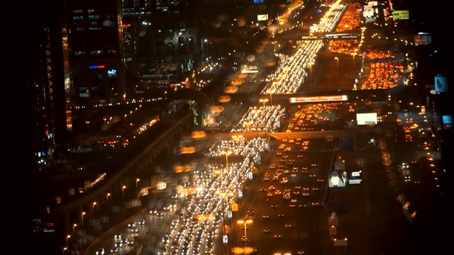 Video Reference: Metropolitan area, Cityscape, Metropolis, Urban area, Night, City, Human settlement, Aerial photography, Light, Lighting, Person