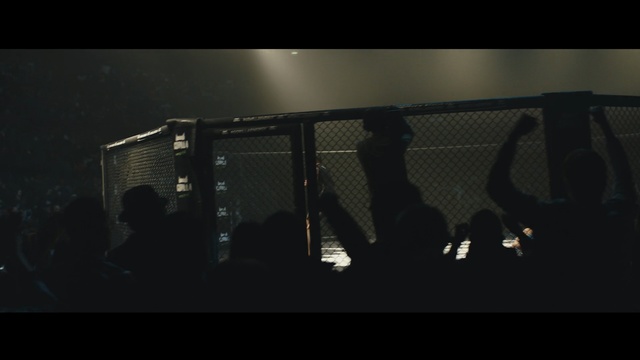 Video Reference: Black, Darkness, Photography, Sky, Line, Night, Font, Midnight, Screenshot, Photo, Man, Monitor, Sitting, Dark, Watching, Screen, Woman, Front, Small, People, Room, Water, Table, Standing, Holding, Computer, Dog, Display, Playing, Riding, Doing, White, Large, Group, Young, Player, Living, Ball, City, Air