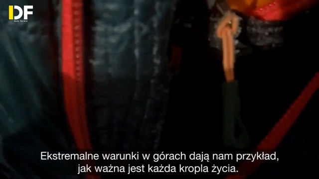 Video Reference: Red, Font, Music, Darkness, Tire, Room, Jacket, Automotive tire, Photography, Personal protective equipment, Person