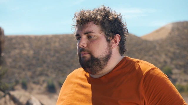 Video Reference: man, facial hair, beard, sky, landscape, human, tree, vacation, soil, rock, Person