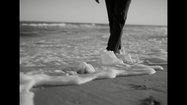 Video Reference: Photograph, Monochrome photography, Black-and-white, Leg, Beach, Photography, Sea, Water, Stock photography, Barefoot, Person, Surfing, Outdoor, Board, Man, Ocean, Holding, Wave, Standing, Front, Suit, Carrying, Walking, Woman, Wet, Body, Girl, Riding, Young, White, Umbrella, Black and white, Shore