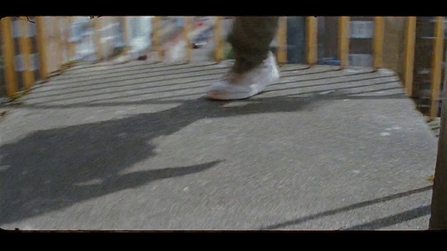 Video Reference: Floor, Hardwood, Flooring, Asphalt, Wood, Sidewalk, Footwear, Shoe, Leg, Road surface