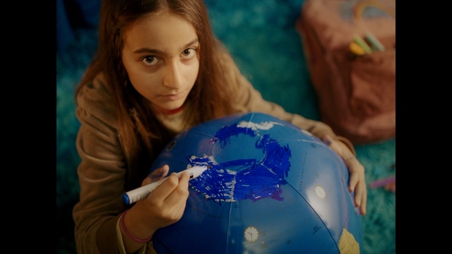 Video Reference: Blue, Globe, Child, World, Earth, Human, Fun, Hand, Smile, Interior design, Person