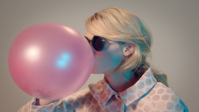 Video Reference: hair, blue, pink, balloon, glasses, nose, human hair color, eyewear, vision care, eye