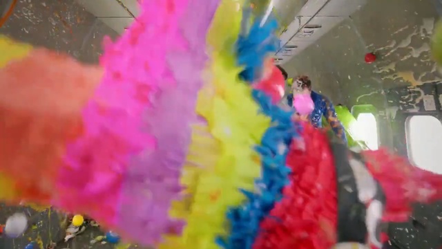 Video Reference: blue, pink, yellow, carnival, festival, fun, event, petal, material, balloon, Person