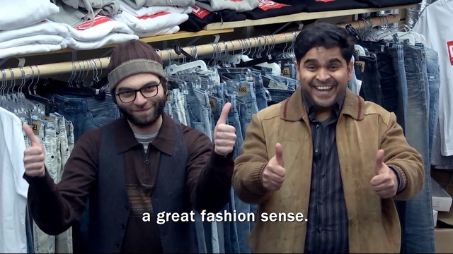 Video Reference: man, market, men, glasses, smile, pants, thumbs up  , Person